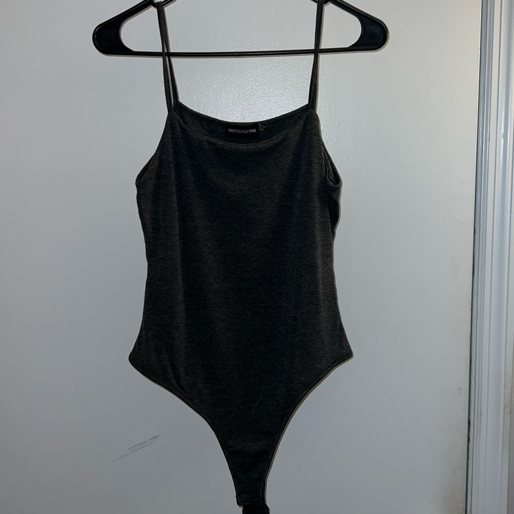Pretty little thing bodysuit. It is dark grey and a US size 6 so a medium!